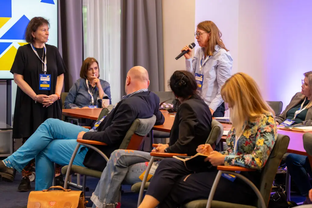Experts discussing in a circle during a think tank meeting