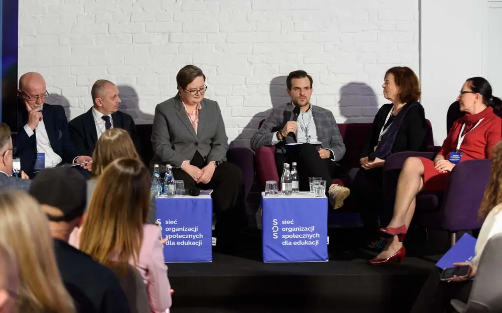 Panellists on stage during an open debate on the Kompas Jutra curriculum reform